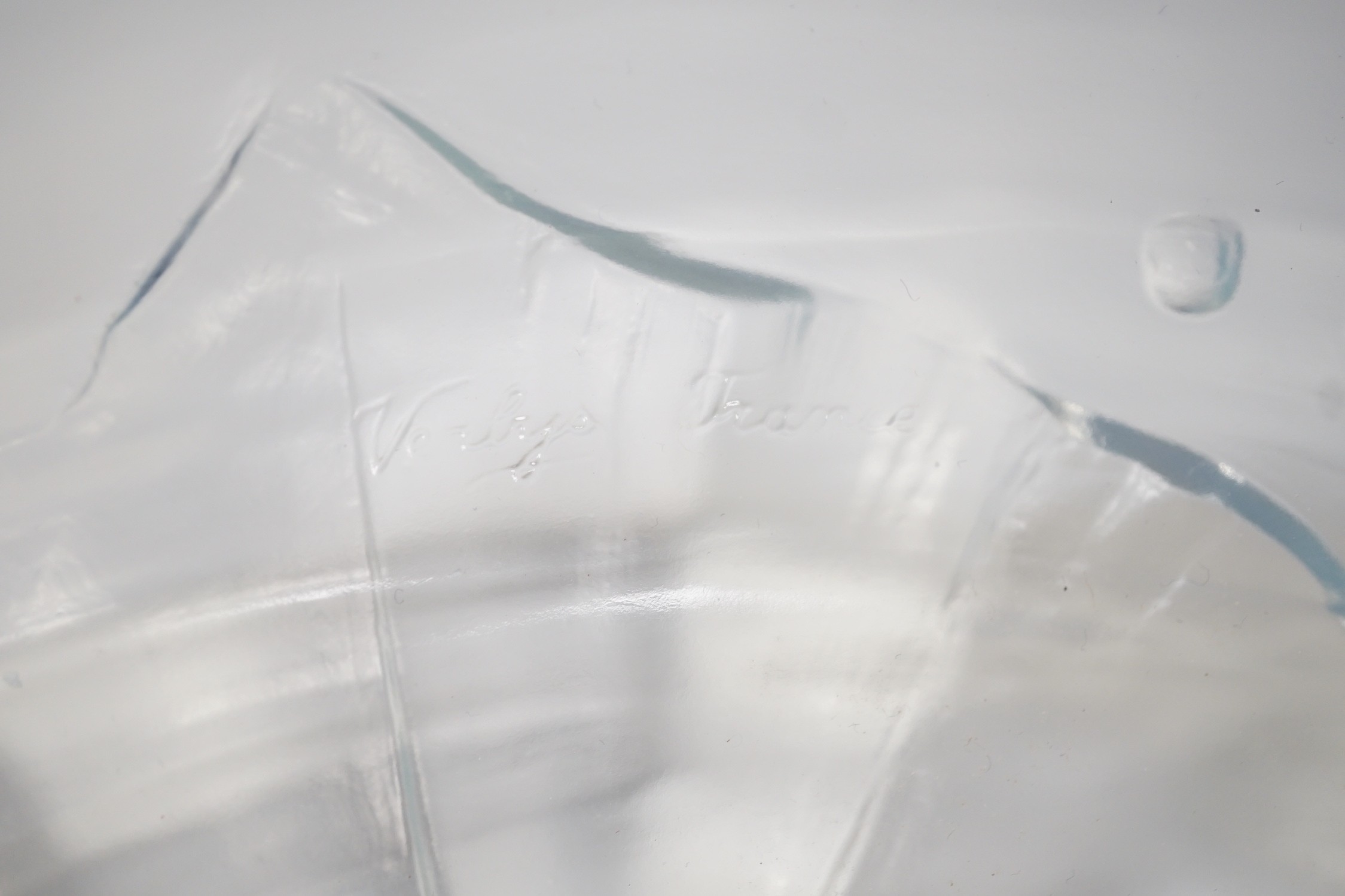 A Verlys opalescent glass dish with flower decoration. 35cm diameter